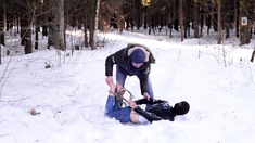 Barefoot Claudia is captured in the cold winter forest