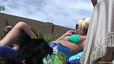 Sexy Blonde Babe Tans Her Perfect Body By The Side Of The Pool